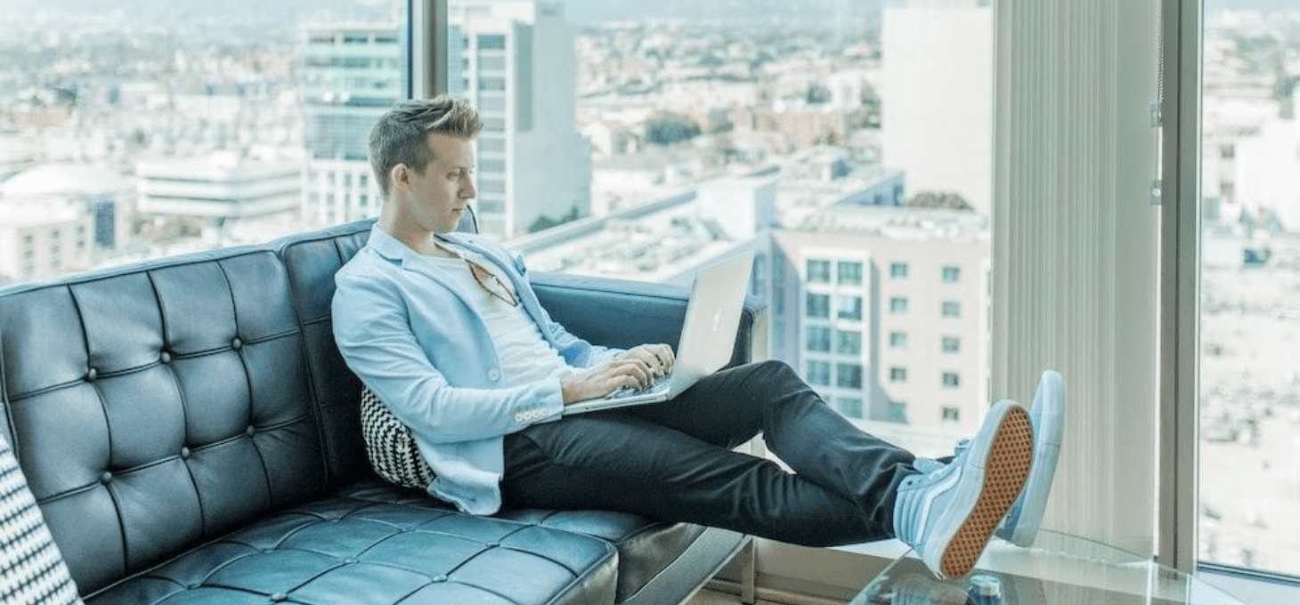 man sitting on couch setting up klaviyo email marketing