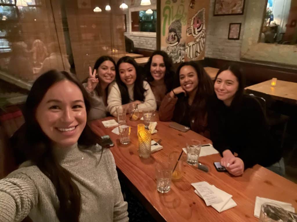 Six members of the social media department at dinner