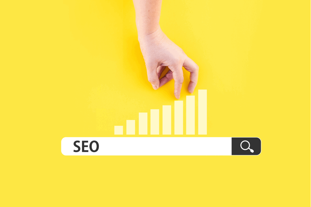 a hand climbing up a representation of the SEO ladder