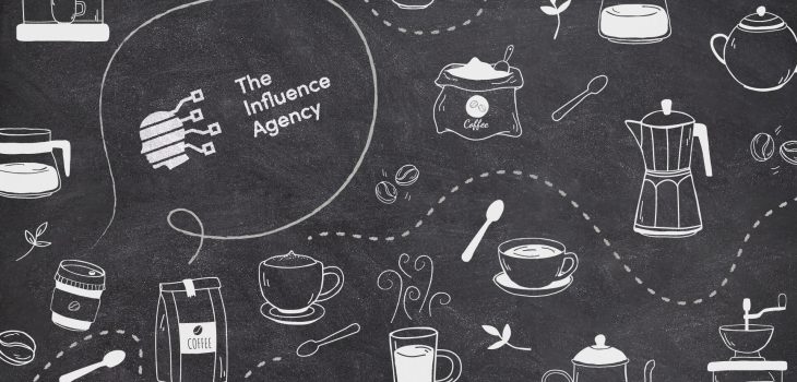 A chalkboard drawing featuring The Influence Agency’s logo, complete with mini graphics of coffee beans, coffee cups, milk, steam, teapot, coffee grinder, coffee pot, etc.