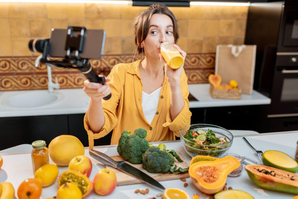A social media influencer creating content about healthy eating for her followers